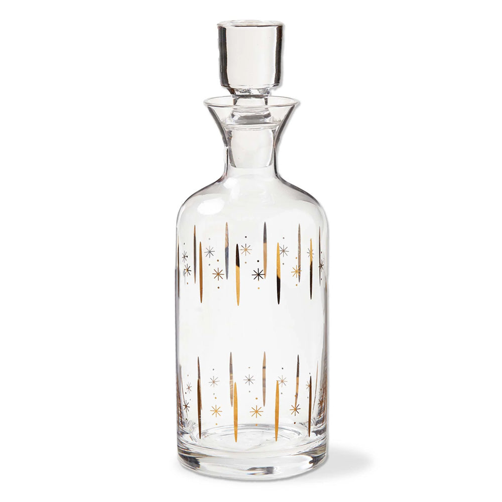 The Starlight Liquor Decanter is a clear glass decanter with a stopper, featuring a gold finish and black starburst patterns accented by vertical lines.