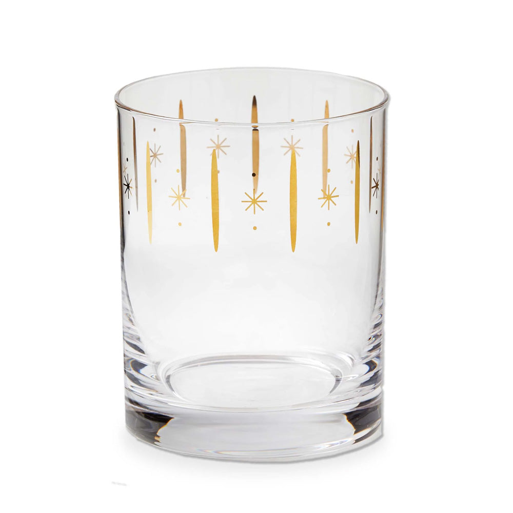 The Starlight Glass is a clear DOF tumbler adorned with vertical gold lines and starburst patterns, displayed on a plain white background.