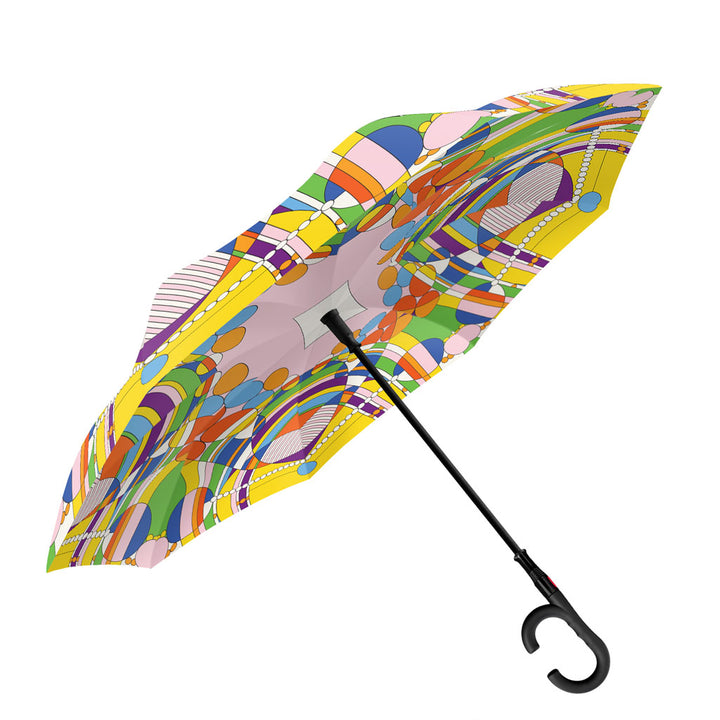 The Frank Lloyd Wright March Balloons Umbrella features a curved black handle and showcases a vibrant abstract pattern of circles and geometric shapes in yellow, orange, purple, green, and blue.