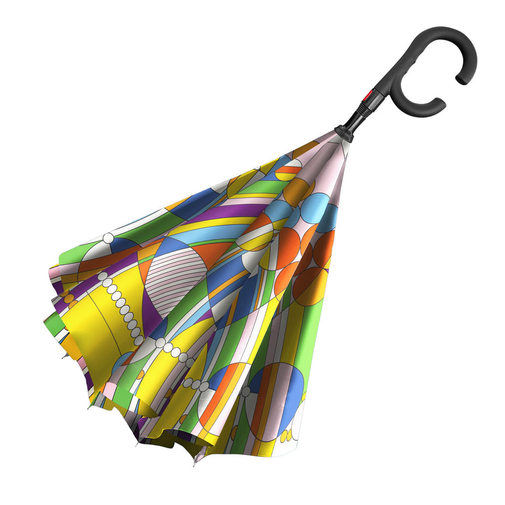 The Frank Lloyd Wright March Balloons Umbrella features an inverted design with abstract geometric patterns in yellow, green, blue, purple, and orange, plus a black curved handle. Displayed against a white background.