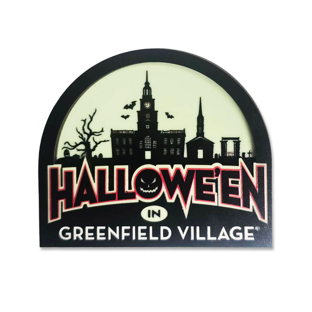 Capture the eerie spirit of the season with the Greenfield Village Halloween Magnet, featuring a “Halloween in Greenfield Village” sign with a spooky village silhouette, bats, a jack-o-lantern face in the O, and a barren tree set against a pale background. This unique glow magnet makes an eye-catching addition to your Halloween décor collection or a perfect gift for fellow fans of festive fright!.