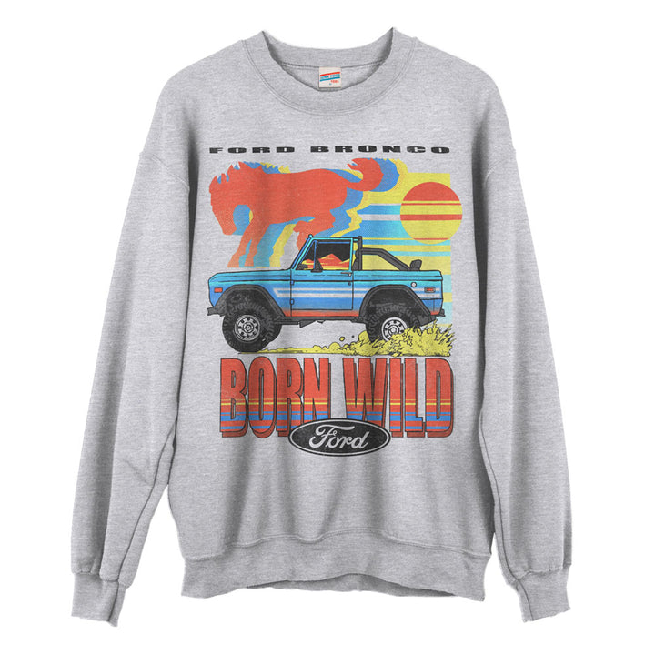 The Ford Bronco Born Wild Fleece Sweatshirt features soft gray fleece, a graphic of a blue Bronco in mud, a red wild horse, sunset, “Ford Bronco Born Wild,” and the black Ford logo—perfect adventure wear for any fan.