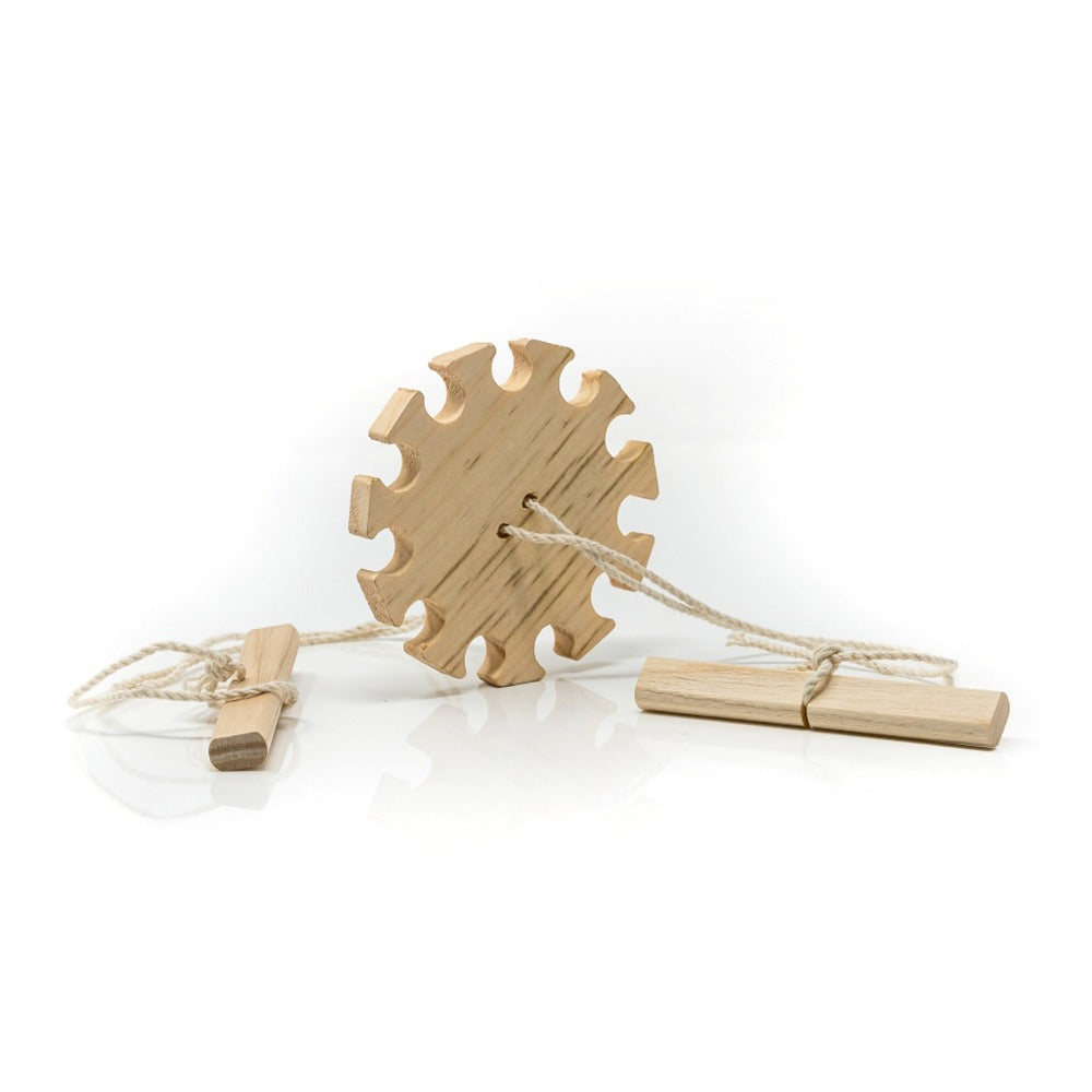 The Wooden Buzz Saw is a handcrafted folk toy with a central gear-shaped piece, two strings threaded through it, and wooden handles on each end—a classic whirligig for timeless fun.