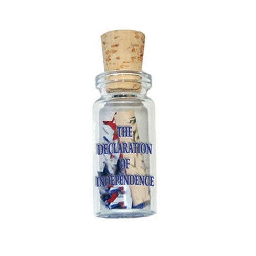 The Mini Declaration of Independence in a Bottle features a tiny rolled document inside a small glass bottle with cork, blue label, and red, white, and blue accents—an educational patriotic keepsake and unique souvenir.
