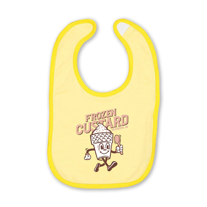 The Frozen Custard Bib is a yellow baby bib with a smiling cartoon frozen custard holding a spoon and "FROZEN CUSTARD" in brown above—a charming souvenir inspired by treats at Greenfield Village.