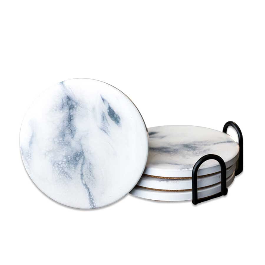 Ceramic Resin Coasters feature a round, marble-patterned design in white with gray veining. Stacked in a sleek black holder and with one displayed in front, they make an elegant, unique gift for any home.