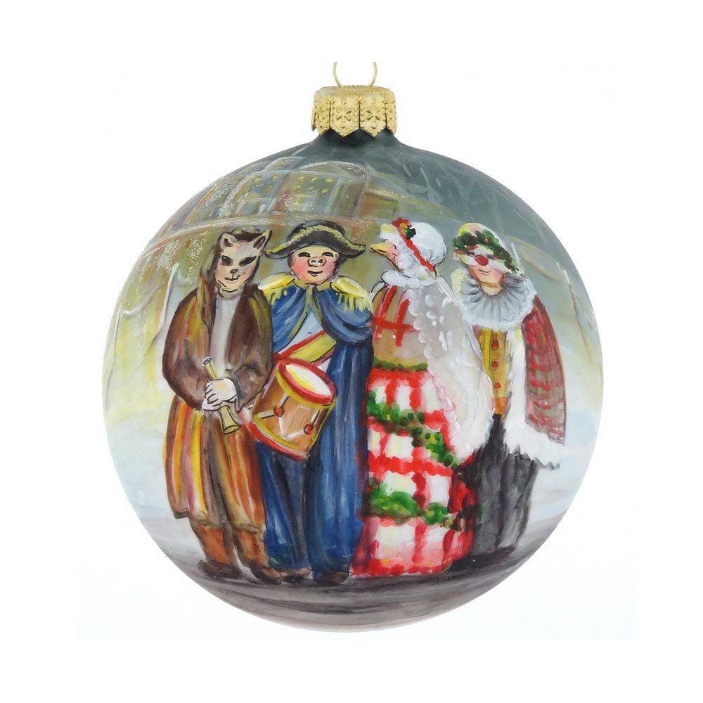The Henry Ford® Greenfield Village Mummers Ornament features four colorful, hand-painted Victorian carolers, one in a cat mask, singing before softly lit buildings inspired by Greenfield Village.