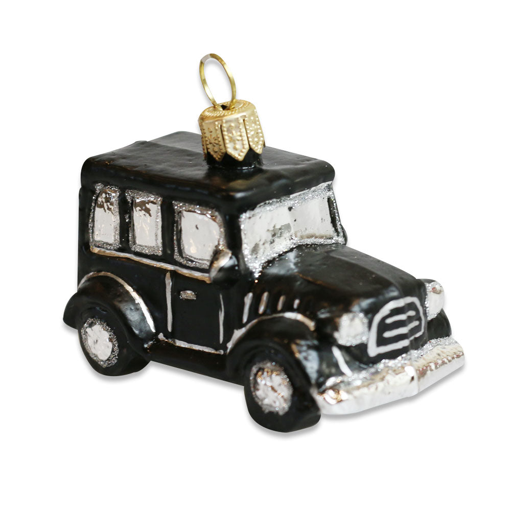 Add a touch of Greenfield Village charm to your tree with the Model T Mini Ornament—a black and silver blown glass vintage-style car, featuring a gold loop for easy hanging.