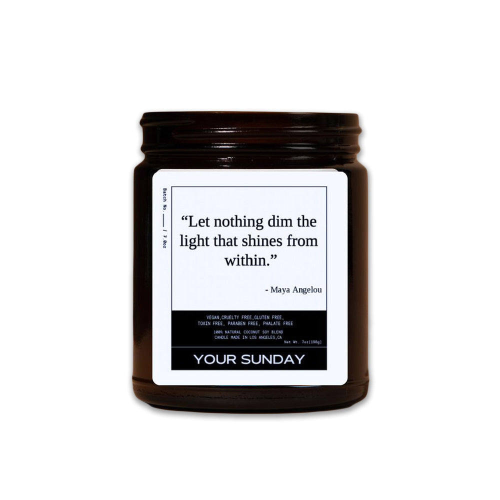 The Your Sunday Maya Angelou Candle comes in a brown glass jar with a quote: "Let nothing dim the light that shines from within." This vegan, cruelty-free soy candle offers uplifting aromatherapy benefits.