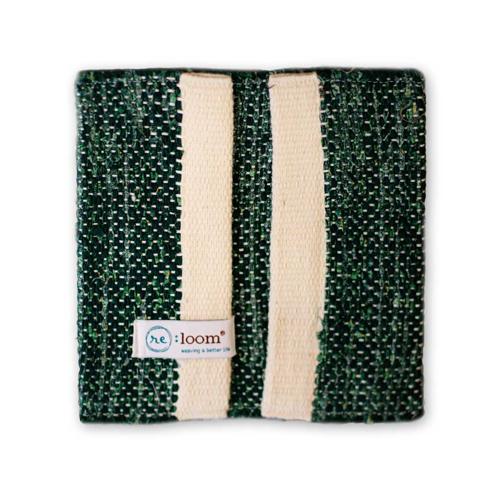 A square green and beige ReLoom Wallet with two beige straps on one side and a small fabric tag—supporting sustainable change and job training with every use.