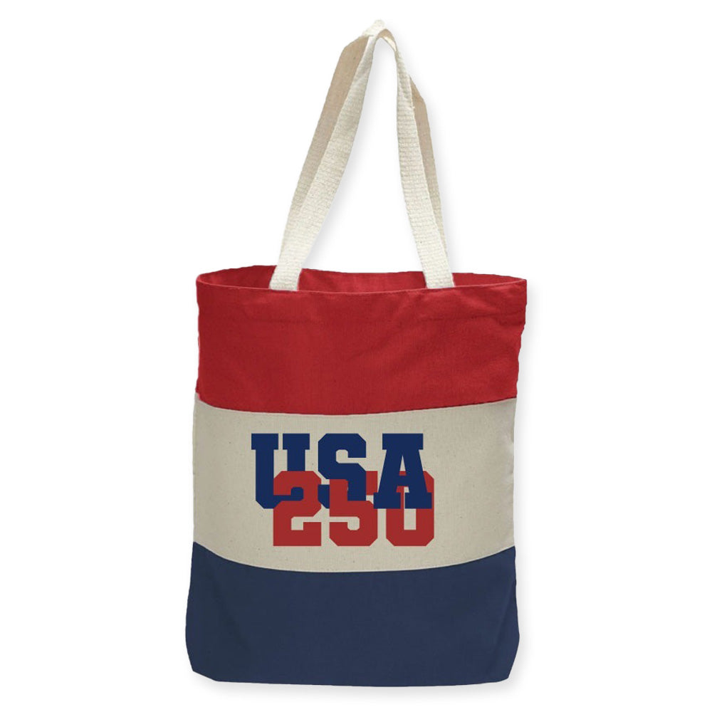 Celebrate in style with the Greenfield Village USA Colorblock Tote, featuring bold red, white, and blue stripes plus USA 250 text—perfect for your next visit to the Henry Ford Museum or a day at Greenfield Village!.
