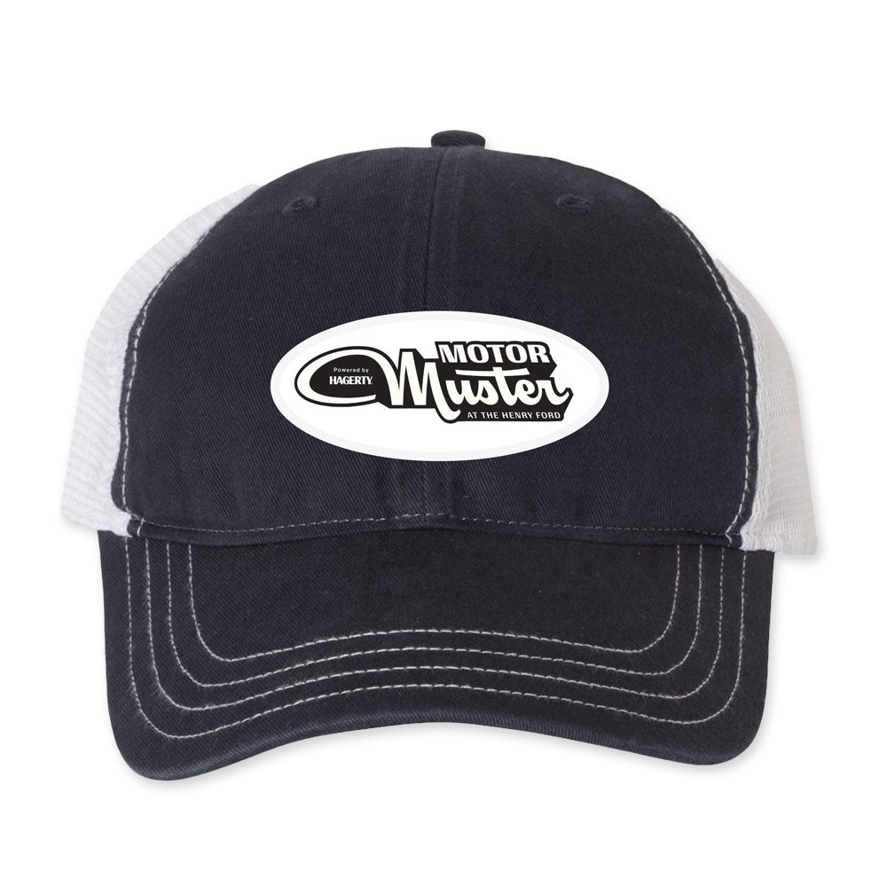 The Greenfield Village 2026 Motor Muster Cap is a black and white trucker hat with white stitching and a front patch that reads "Motor Muster"—perfect for fans of historic car shows.