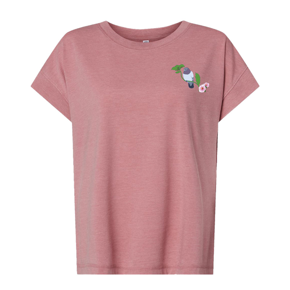 The Roberto Lugo Pretty Pigeon Women's T-Shirt is a dusty pink, short-sleeved tee featuring an embroidered bird with a leaf and pink flower on the left chest, inspired by handcrafted exhibits.