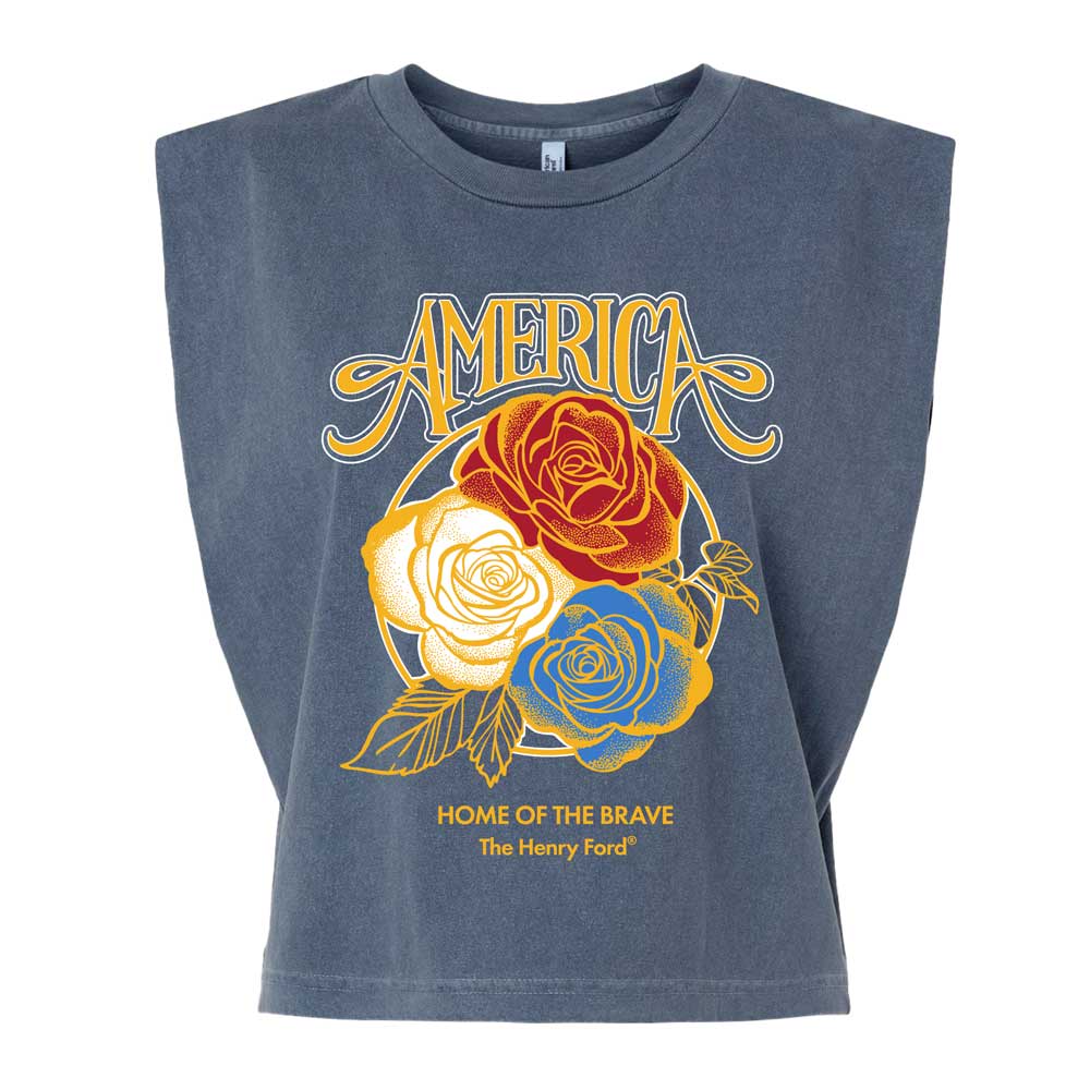 The Henry Ford® America's Birthday Concert Tour Women's Muscle T-Shirt is a sleeveless gray tee with “AMERICA” above red, white, and blue roses and “HOME OF THE BRAVE” and “The Henry Ford®” below, celebrating America’s 250th anniversary.