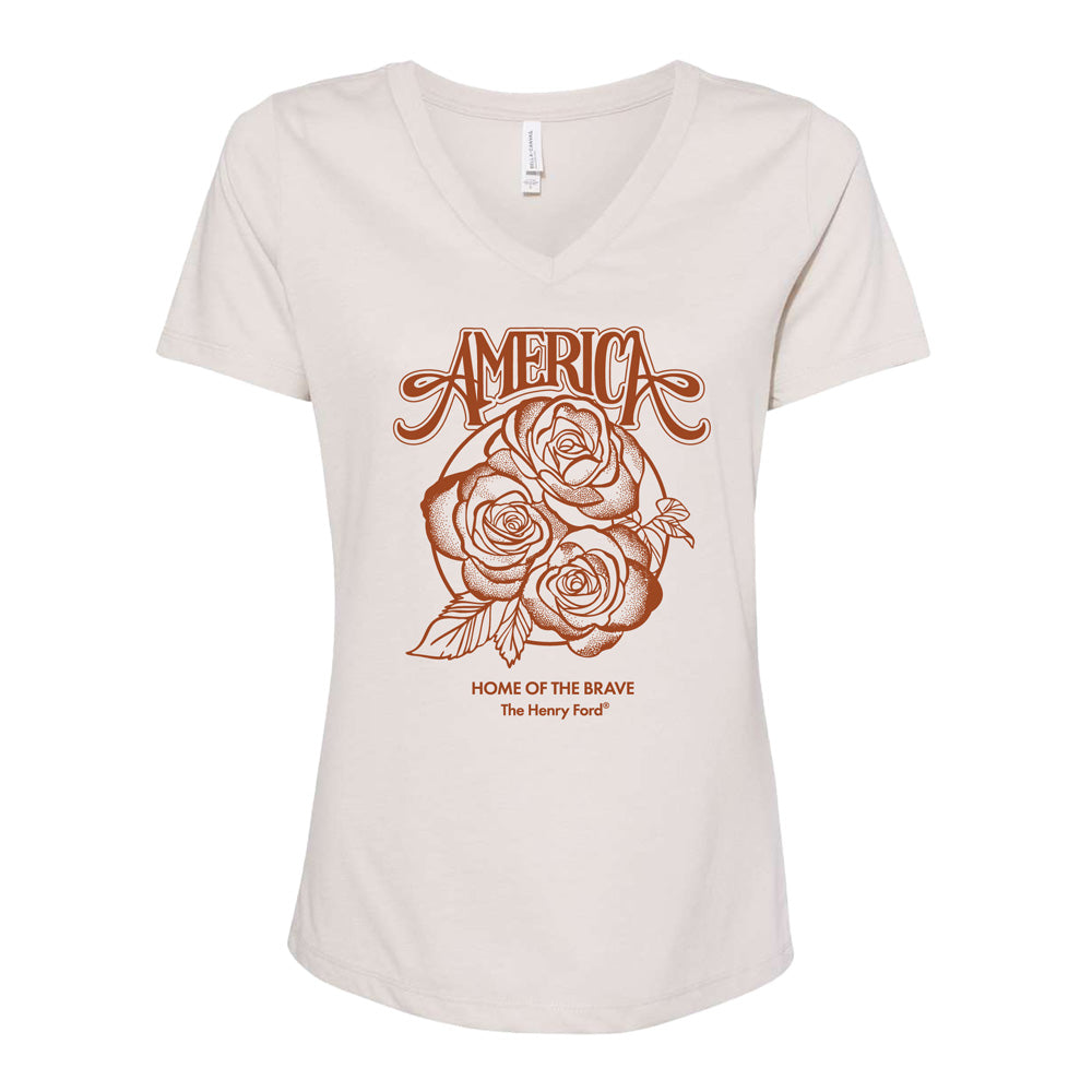 Celebrate America’s 250th with The Henry Ford® Concert Tour Roses Women’s V-Neck T-Shirt in cream, featuring “AMERICA” above a rose and “HOME OF THE BRAVE The Henry Ford®” below—a stylish tribute to The Henry Ford Museum.