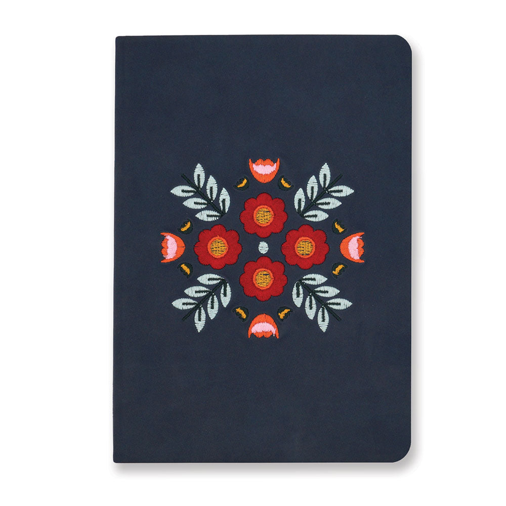 The Evelyn Blue Embroidered Journal features a navy cover with red and pink floral embroidery, green leaves, and yellow accents—perfect as a lined journal for capturing your thoughts and notes.