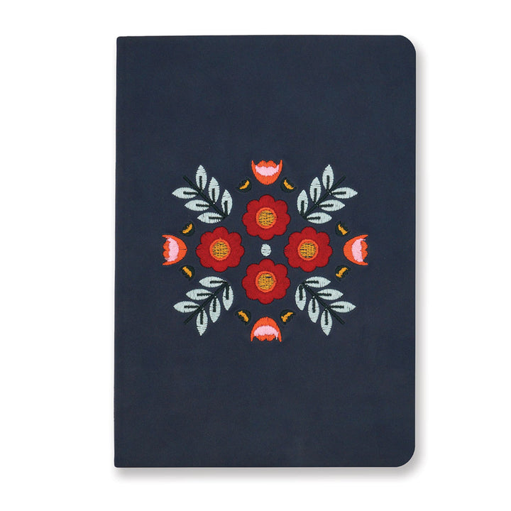 The Evelyn Blue Embroidered Journal features a navy cover with red and pink floral embroidery, green leaves, and yellow accents—perfect as a lined journal for capturing your thoughts and notes.