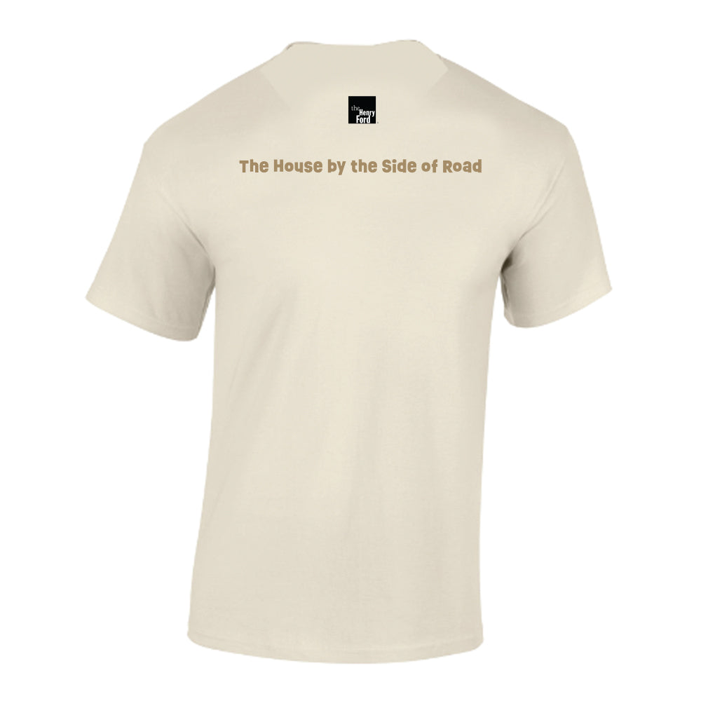 Greenfield Village Jackson Home T-Shirt in beige, shown from the back with "The House by the Side of Road" printed across the upper back and a small black-and-white square Americana logo centered near the neckline.