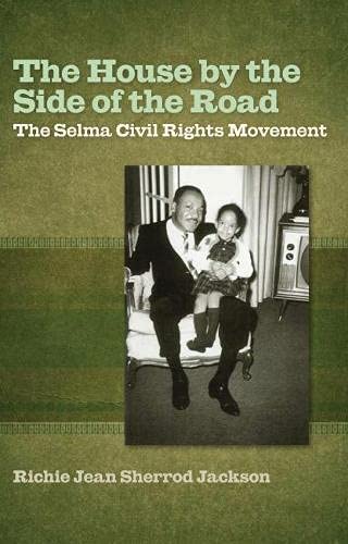 Book cover for The House by the Side of the Road features a black-and-white photo of an adult and child on a couch, reflecting themes from the Selma civil rights movement and Bloody Sunday.