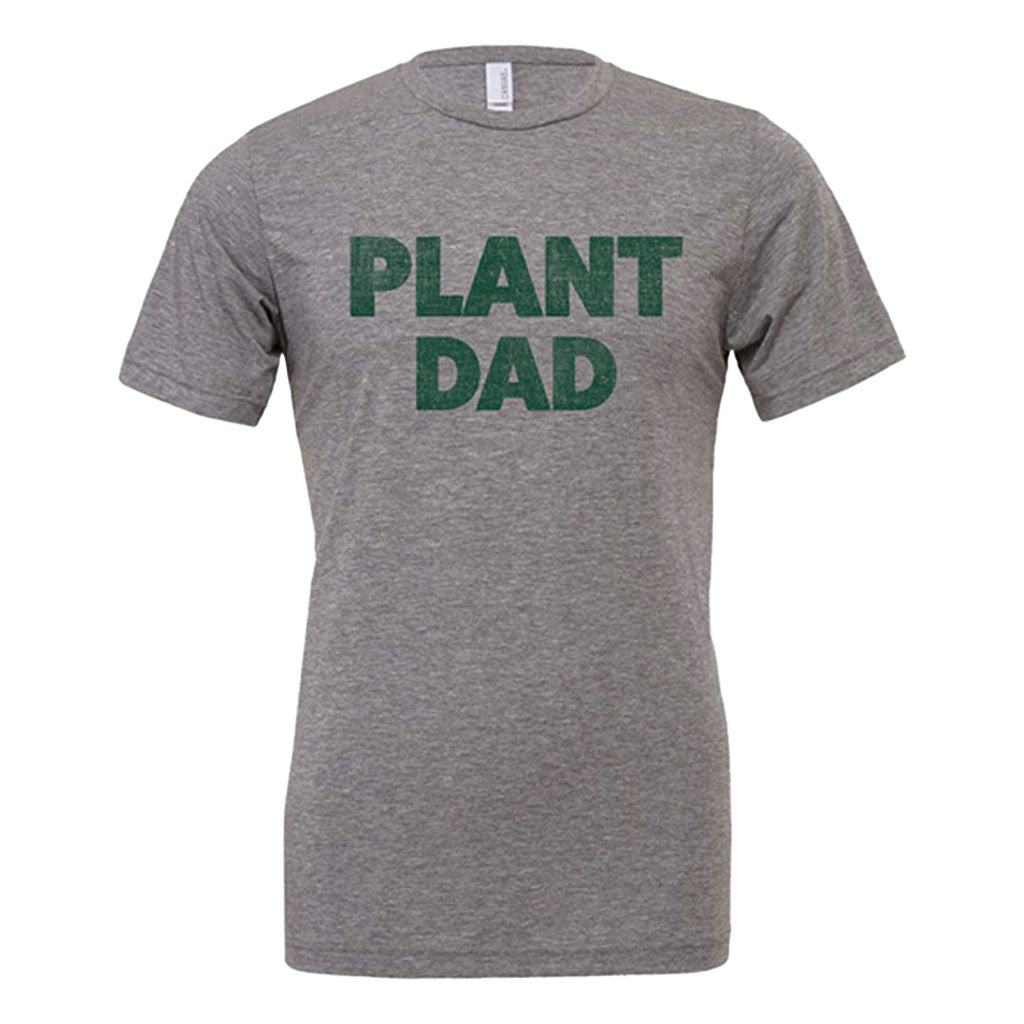 The Plant Dad T-Shirt is a gray short-sleeve tee featuring "PLANT DAD" in bold green letters—ideal for any plant dad.