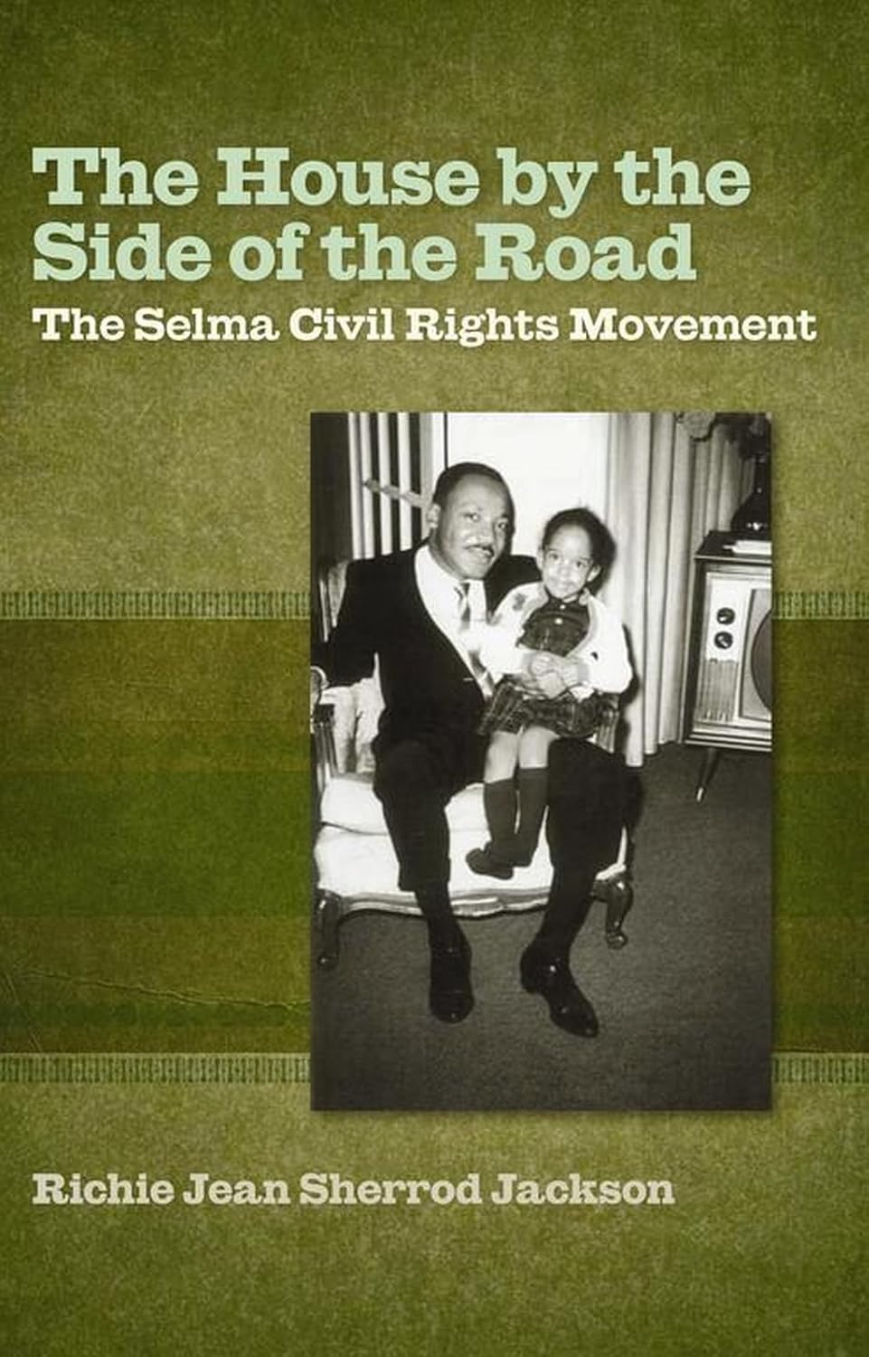 Book cover for The House by the Side of the Road, featuring a historical photograph of a man and a child sitting together—depicting the essence of the Selma civil rights era and commemorating key events like Bloody Sunday.