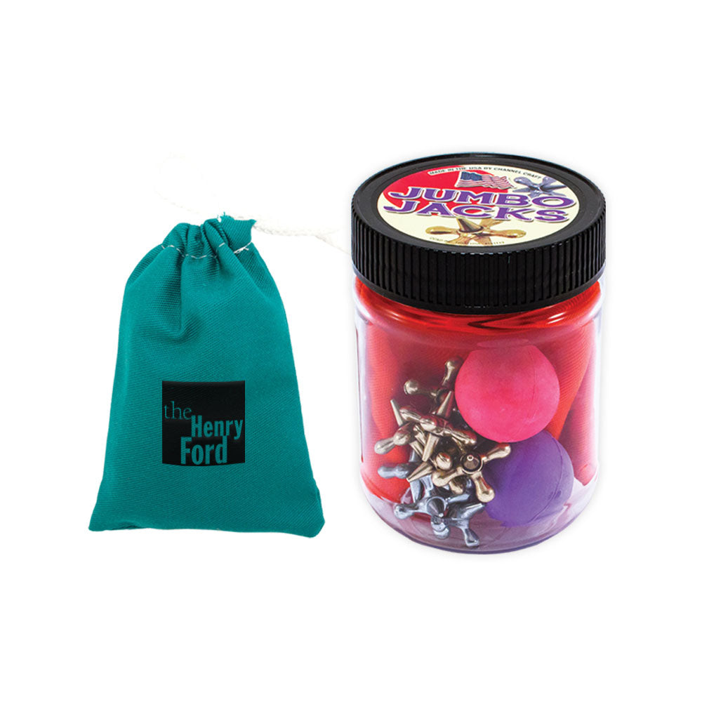 The Jumbo Jacks Game comes with jacks and rubber balls in a jar, plus a green drawstring bag labeled The Henry Ford—ideal for classic family fun.