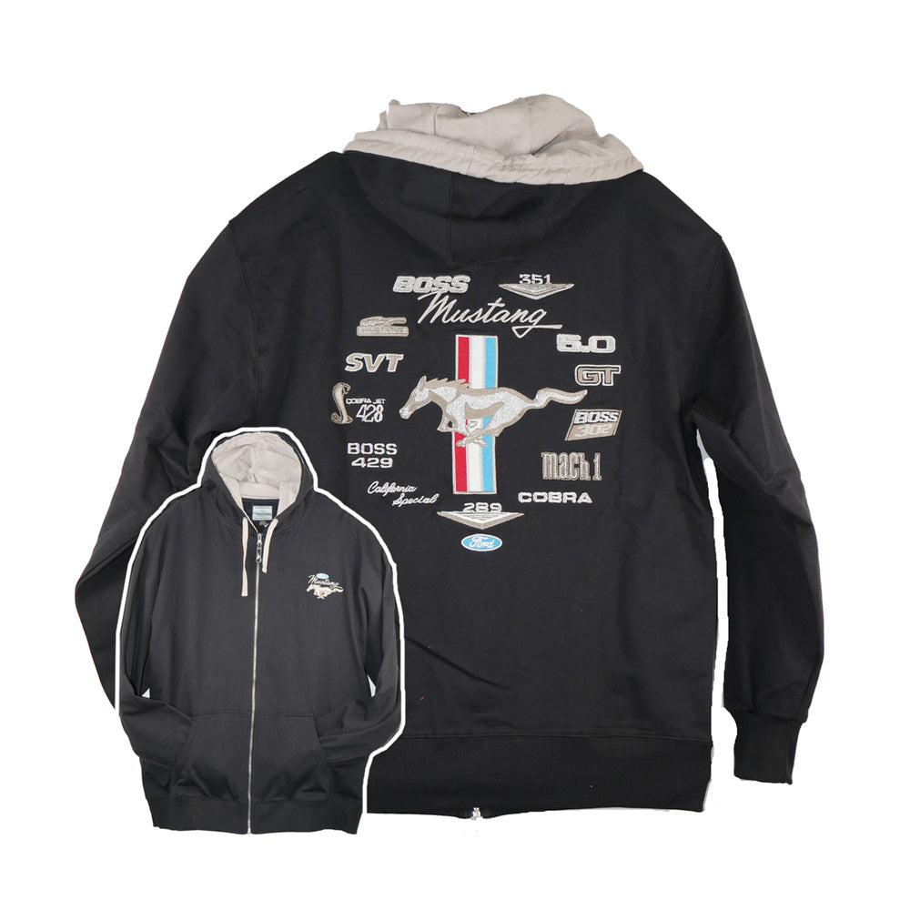 The Ford Mustang Embroidered Hooded Jacket is a black zip-up hoodie with a contrasting white hood. It showcases a striking large back design, featuring the iconic Ford Mustang logo, red-white-blue stripes, and the names of various Mustang car models. A small embroidered Mustang logo accents the front left chest, making this the ideal jacket for any Ford Mustang enthusiast.