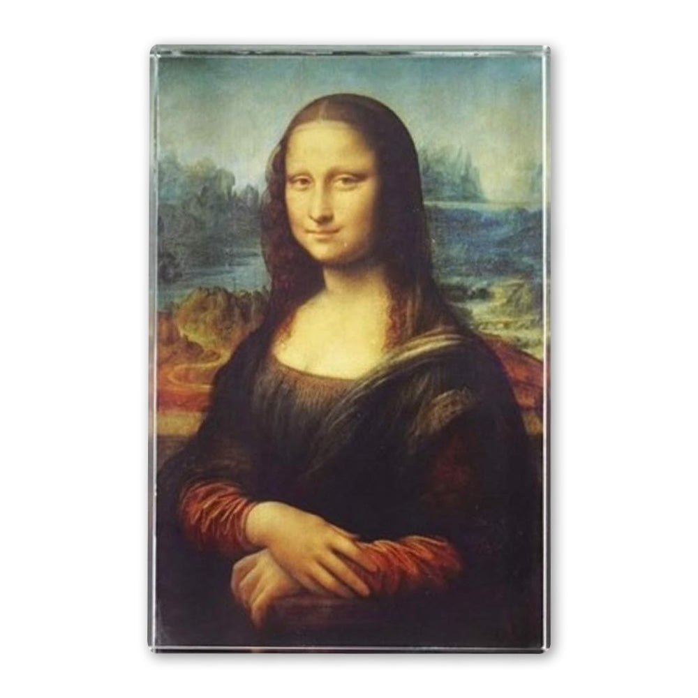 The Da Vinci Mona Lisa Rectangular Crystal Paperweight features the iconic painting of a woman with long brown hair in a dark dress, seated with crossed hands before a landscape—an ideal gift for art lovers and fans of Renaissance masterpieces.