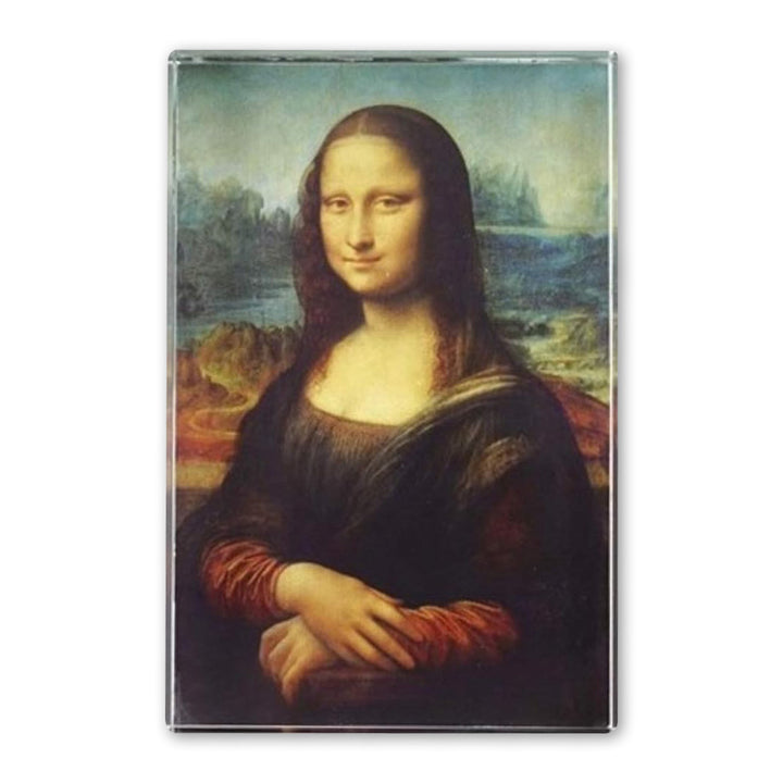 The Da Vinci Mona Lisa Rectangular Crystal Paperweight features the iconic painting of a woman with long brown hair in a dark dress, seated with crossed hands before a landscape—an ideal gift for art lovers and fans of Renaissance masterpieces.