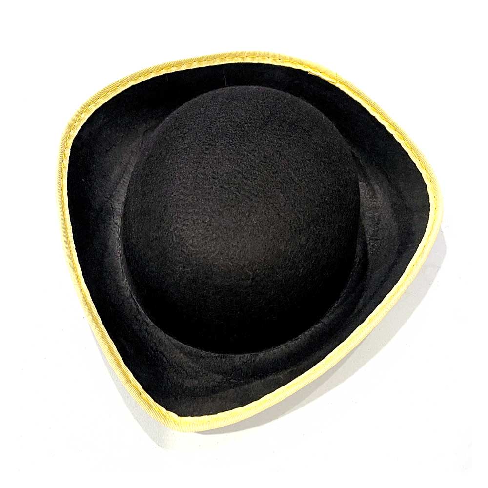 The Colonial Tricorn Hat features a wide, upturned brim and yellow trim along the edges, inspired by American Revolution styles, shown against a white background.