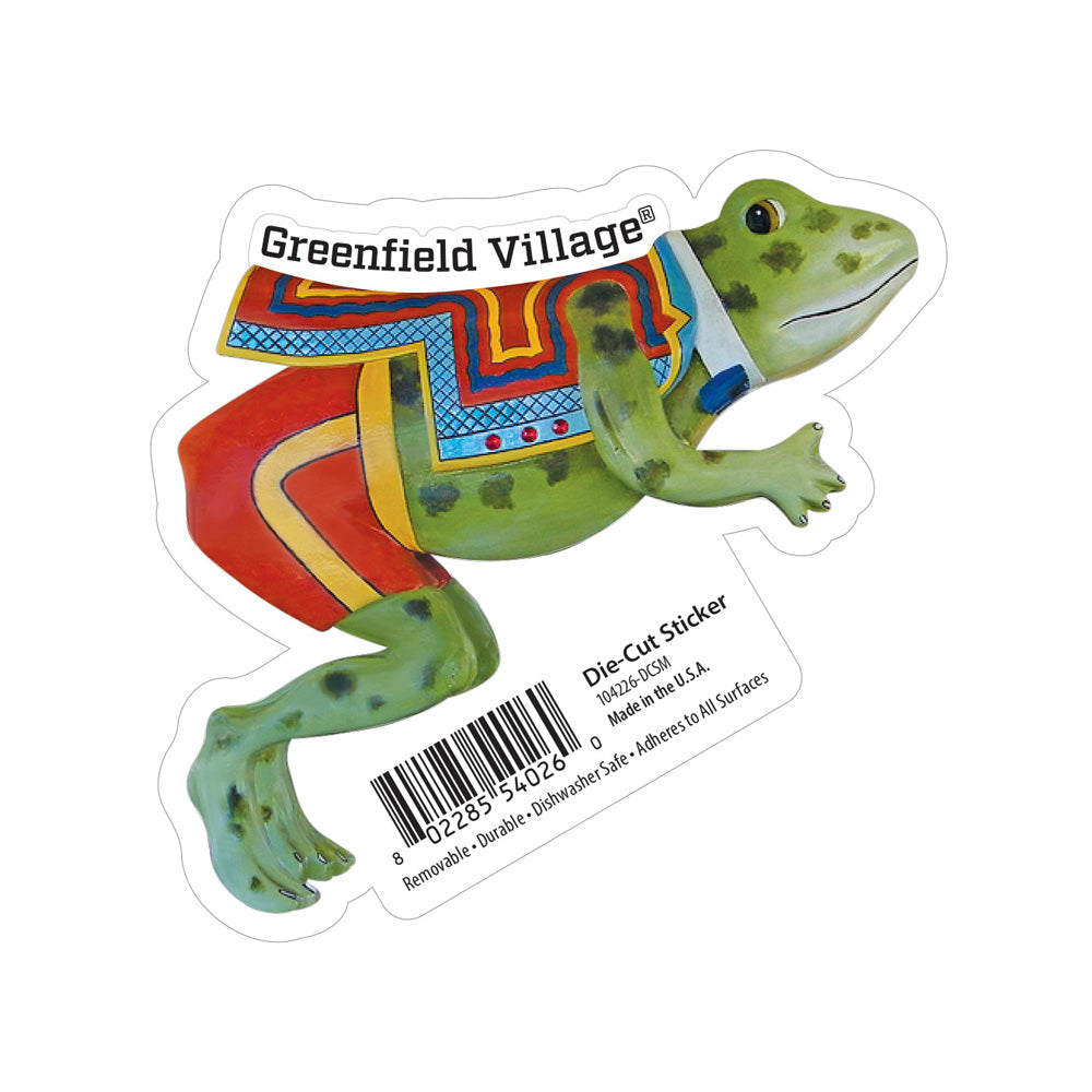 The Hershel the Frog Sticker showcases a lively, patterned frog with Greenfield Village® displayed overhead. Whimsical carousel details enhance its charm, and product information appears in the lower right corner.