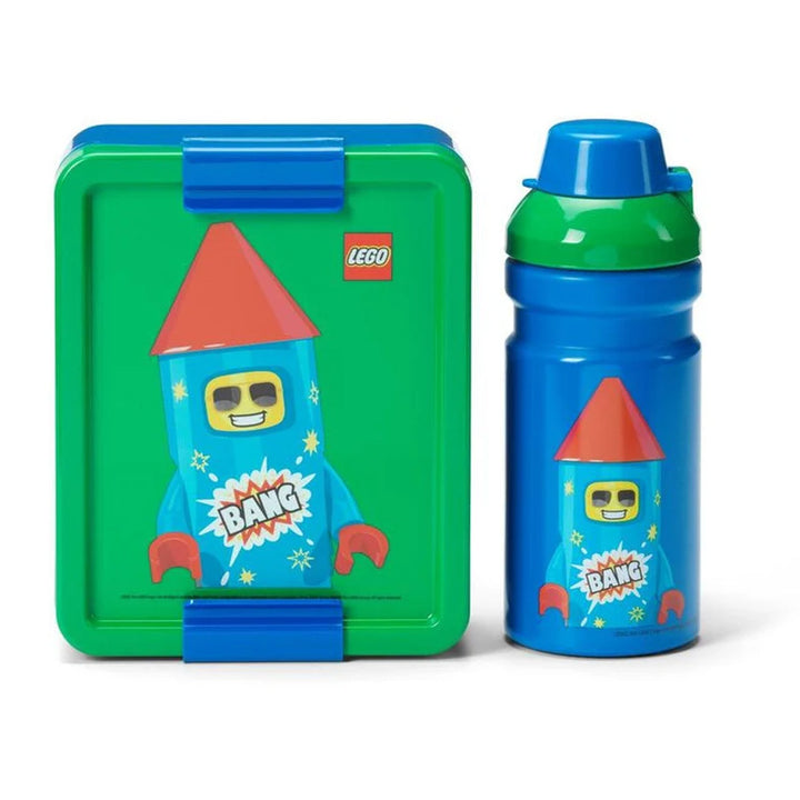 The LEGO Lunch Set is a playful green and blue lunch box and water bottle combo, both decorated with a smiling rocket character, vibrant BANG text, and stars—perfect for young LEGO fans.