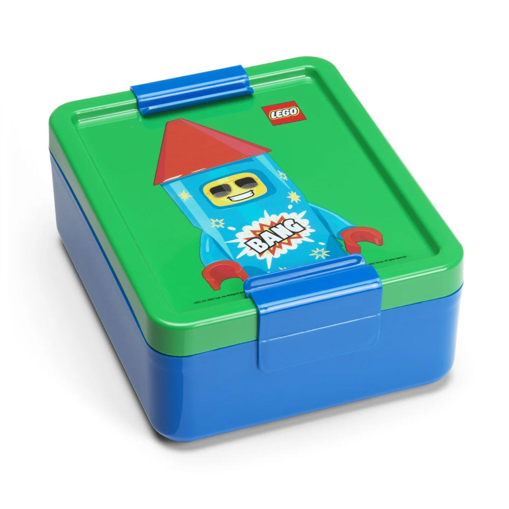 This LEGO Lunch Set features a blue and green lunch box decorated with a cartoon rocket character and the word “BANG” on the lid. Perfect for any kids’ lunch box collection, it includes secure blue clasps and displays the LEGO logo in the top right corner.
