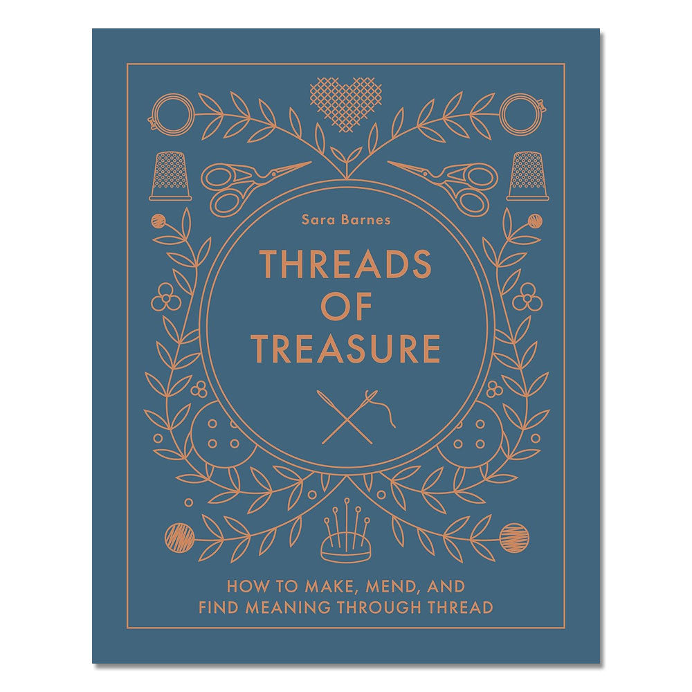 A blue cover book, Threads of Treasure: How to Make, Mend, and Find Meaning through Thread by Sara Barnes, features gold line drawings of sewing tools and plants—perfect for modern crafters exploring creative embroidery projects.