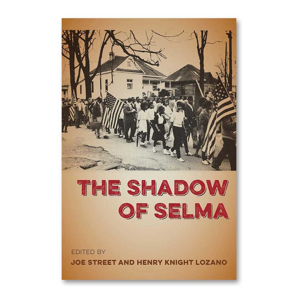 The book "The Shadow of Selma" features a sepia-toned cover depicting a historic Selma civil rights march with American flags. The bold red title stands out, and the editors are Joe Street and Henry Knight Lozano.