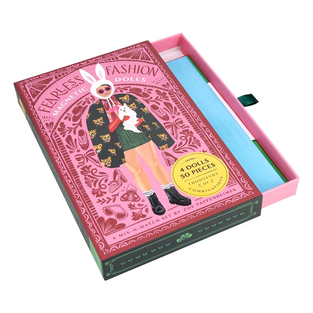 The “Fearless Fashion Magnetic Dolls” pink box features an illustrated girl in a cape with a cat and bunny ears. The set includes magnetic dolls and mix-and-match outfits for thousands of creative fashion combinations.