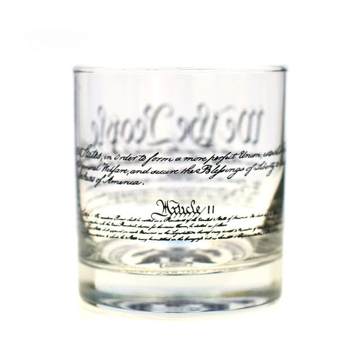 The Declaration of Independence Rocks Glass features decorative script-style printed text wrapping around the glass—perfect for history fans.
