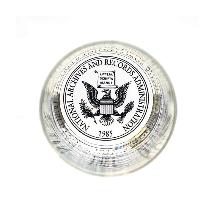 The Declaration of Independence Rocks Glass makes a fitting companion to your glass collection, especially when paired with a National Archives eagle logo paperweight featuring a bald eagle, laurel branches, “Littera Scripta Manet,” and “1985.”.