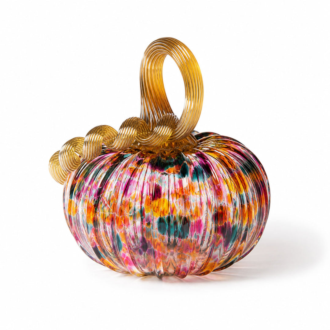 A Small Glass Pumpkin - Kaleidoscope, featuring a hand-blown, ribbed multicolored body and a golden curly stem, is displayed against a white background. This collectible keepsake captures the artistry inspired by Greenfield Village.