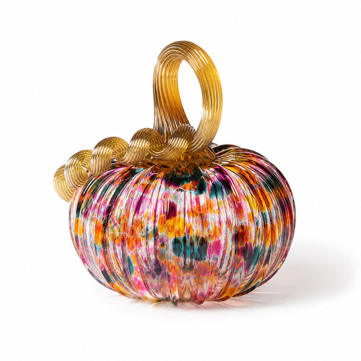 A Small Glass Pumpkin - Kaleidoscope, featuring a hand-blown, ribbed multicolored body and a golden curly stem, is displayed against a white background. This collectible keepsake captures the artistry inspired by Greenfield Village.