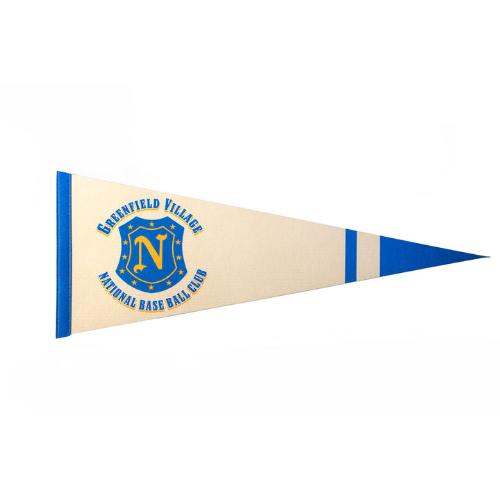 A cream and blue vintage Greenfield Village Base Ball Club Pennant with “Deerfield Village National Base Ball Club” around a blue and yellow N crest, stars, and a baseball makes a unique collectible on a white background.