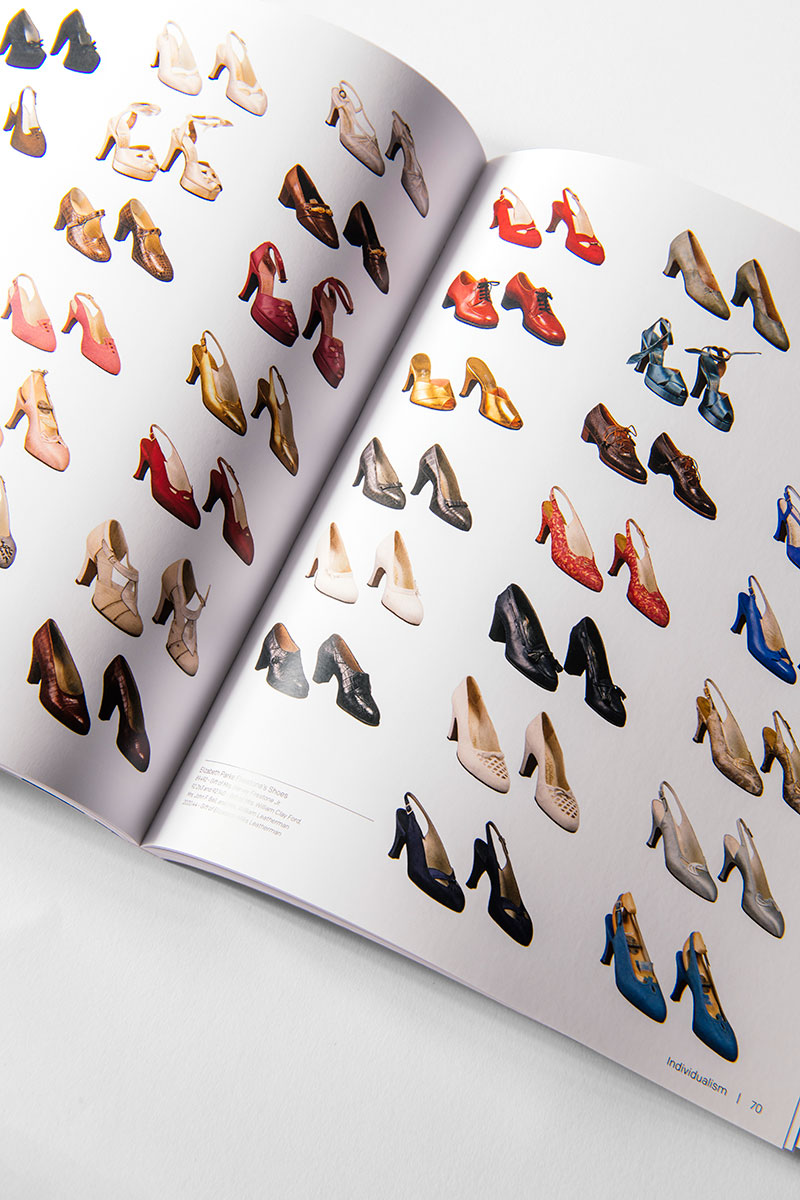 An open copy of “The Henry Ford’s Fabric of America and Handmade Exhibition Catalog” displays pages filled with rows of vintage women’s shoes in an array of colors and styles, set against a white background—evoking the spirit of American artifacts featured in the exhibition.