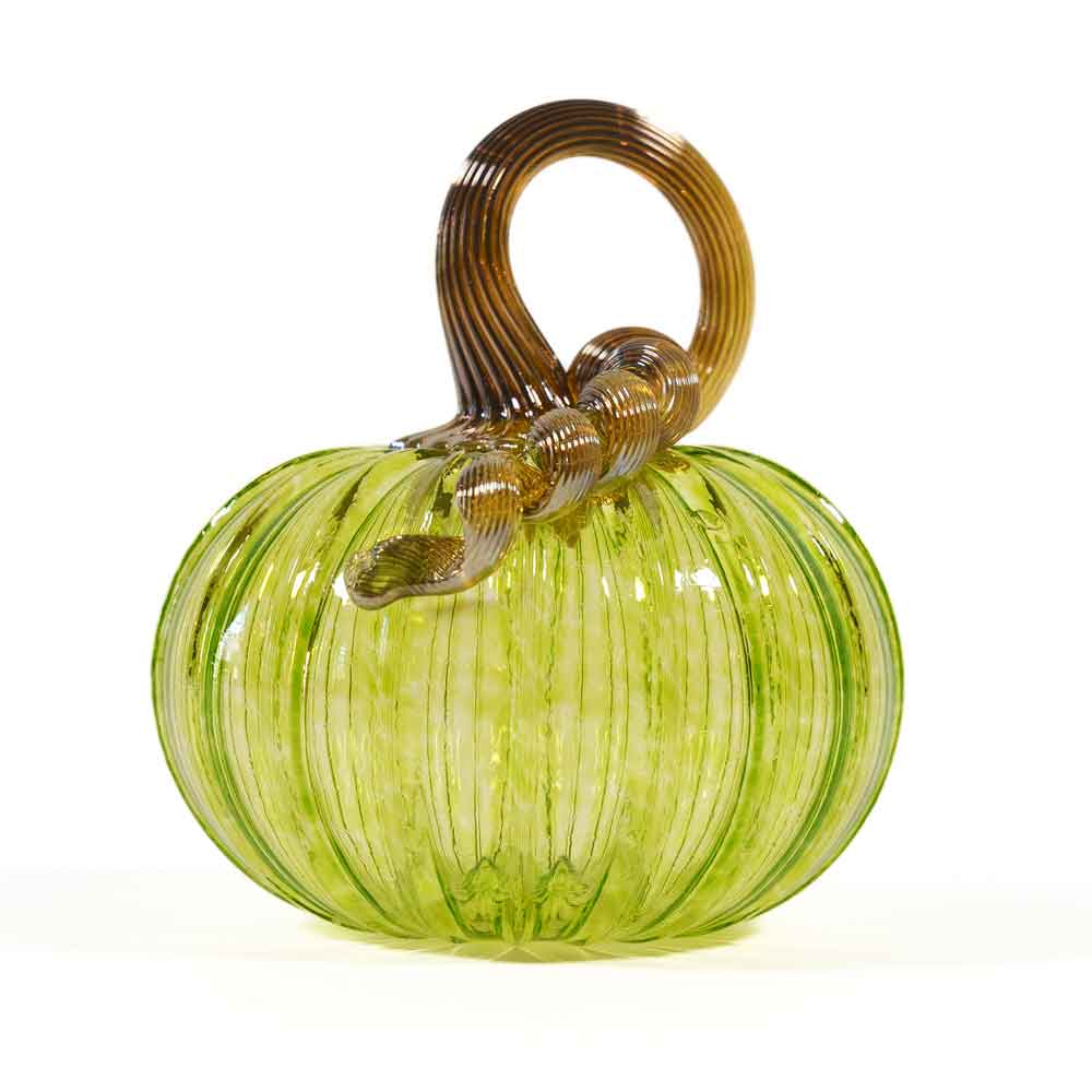 A hand-blown Small Glass Pumpkin - Lime, featuring vertical ridges and a twisted brown glass stem, is displayed on a white background; this collectible keepsake captures the timeless charm of Greenfield Village.