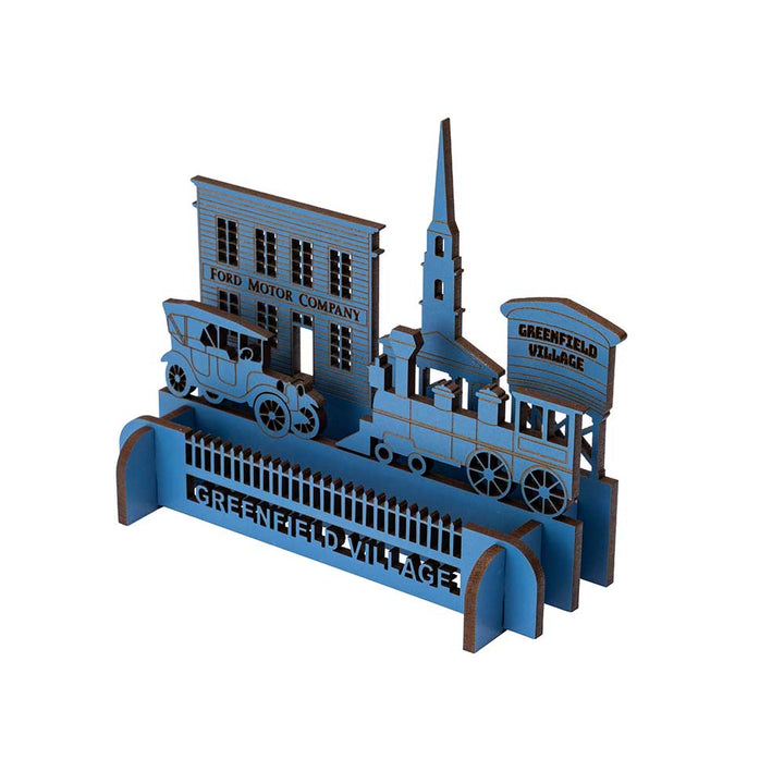 The Henry Ford® Greenfield Village 3D Wooden Puzzle: Laser-cut wooden kit with a vintage car, church steeple, train, “Ford Motor Company” building, and “Greenfield Village” sign—ideal for fans of this iconic living museum.