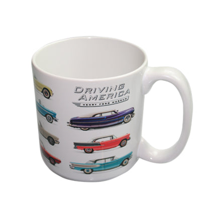 The Muscle Car 20oz Mug features vibrant illustrations of classic cars with "Driving America" above them—ideal for muscle car enthusiasts or as a souvenir from an automotive exhibition.