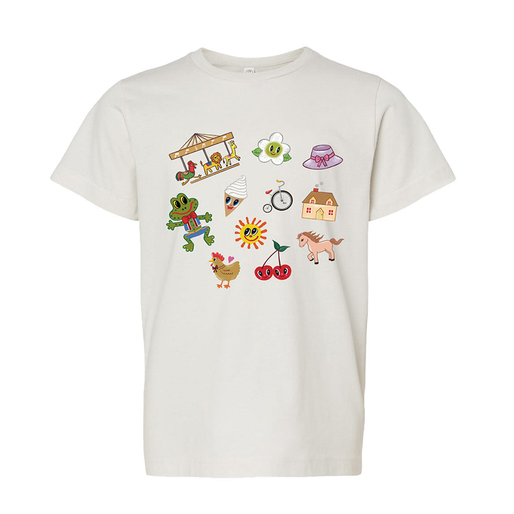 The Greenfield Village Icons Youth T-Shirt is a white tee for kids featuring colorful cartoon illustrations by Humberto Cruz, such as a merry-go-round, frog, sun, chicken, cherries, house, bike, pony, bonnet, flower, and beehive.