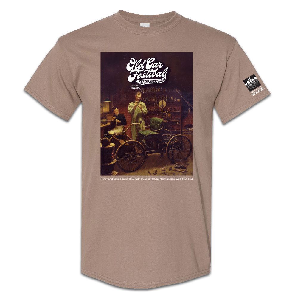 The Henry Ford® Old Car Festival T-Shirt in tan features a classic illustration of Henry Ford with the Quadricycle, event details, and a small The Henry Ford logo on the sleeve.