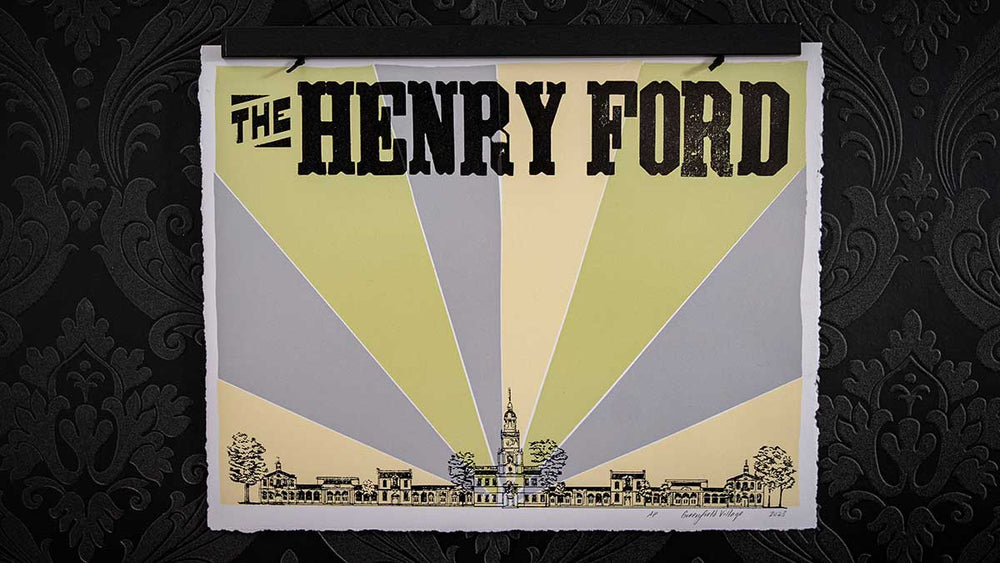 The THF Letterpress Poster showcases a stylized historic building with yellow and gray rays radiating out, set on a dark patterned background inspired by Greenfield Village, and features the text "The Henry Ford.