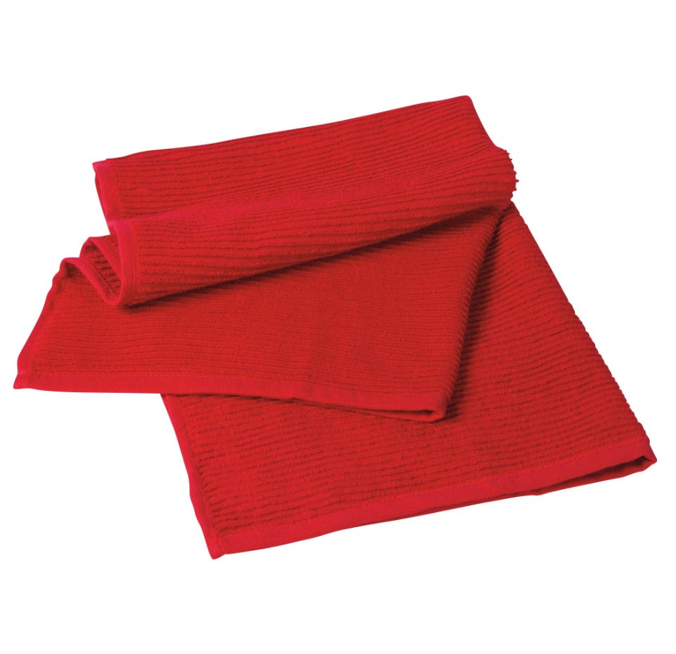 A highly absorbent Ripple Red Dishtowel, made in Turkey, is shown folded and stacked against a white background.