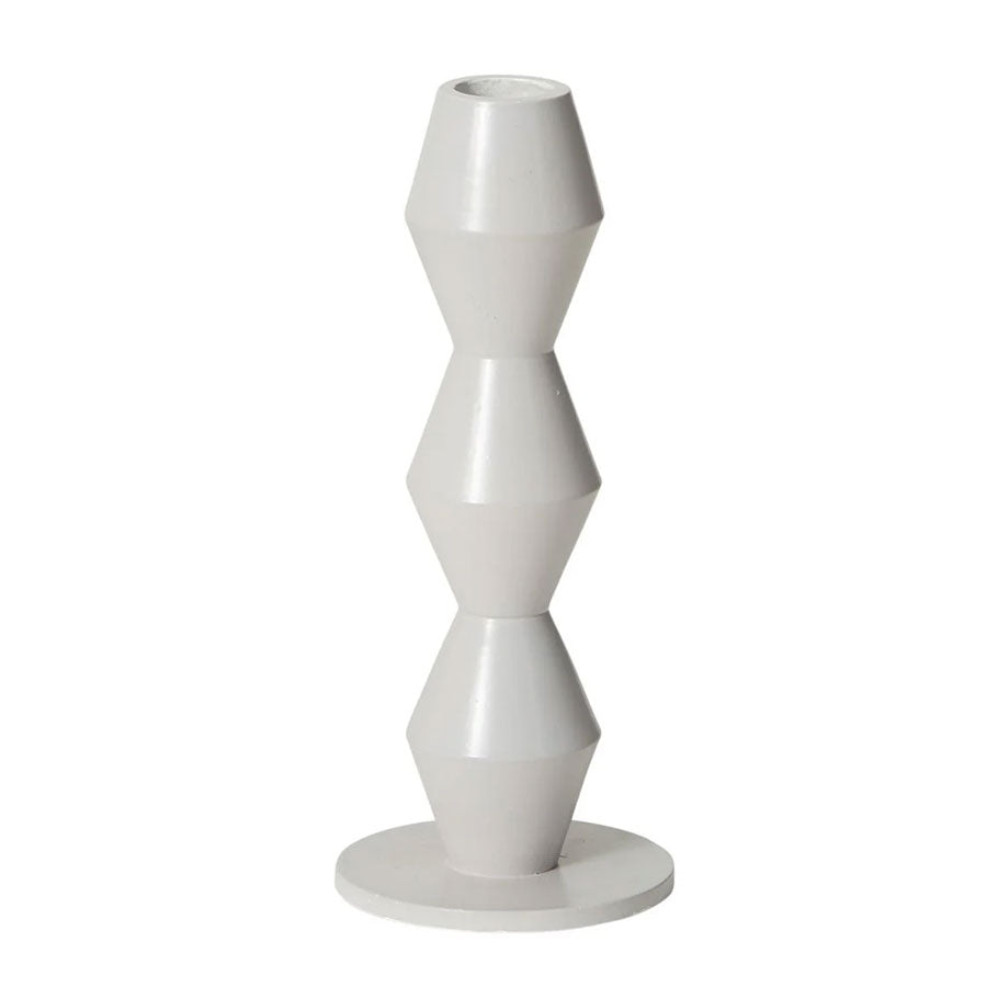 The Vector Tabletop Metal Candlestick features three stacked, hourglass-shaped segments and a flat circular base—adding a modern geometric touch, perfect for displaying taper candles.